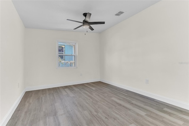 unfurnished room featuring ceiling fan, light hardwood / wood-style floors, and vaulted ceiling