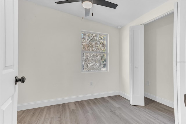 unfurnished bedroom featuring ceiling fan and light wood-type flooring