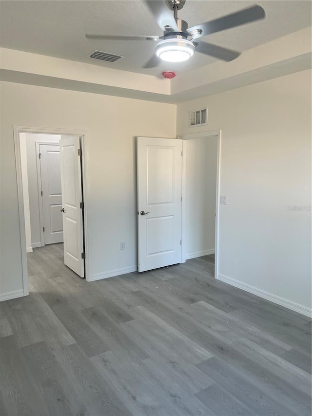 unfurnished bedroom featuring ceiling fan and hardwood / wood-style floors