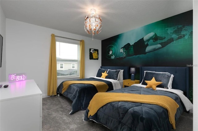 bedroom featuring carpet flooring and a textured ceiling