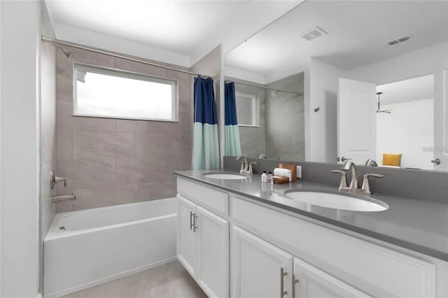 bathroom with vanity and shower / tub combo with curtain