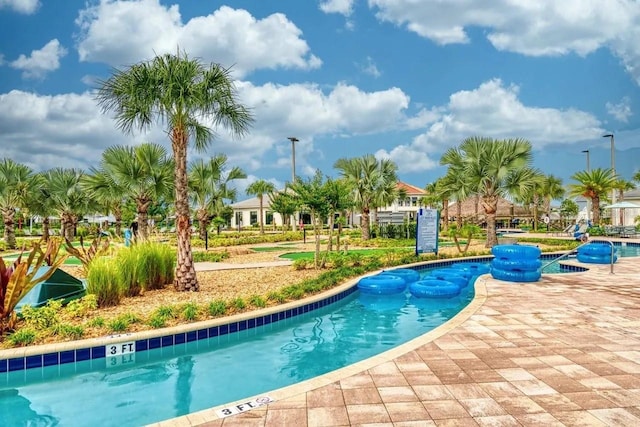 view of swimming pool featuring a patio area