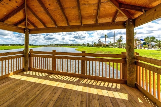 wooden terrace with a gazebo and a water view