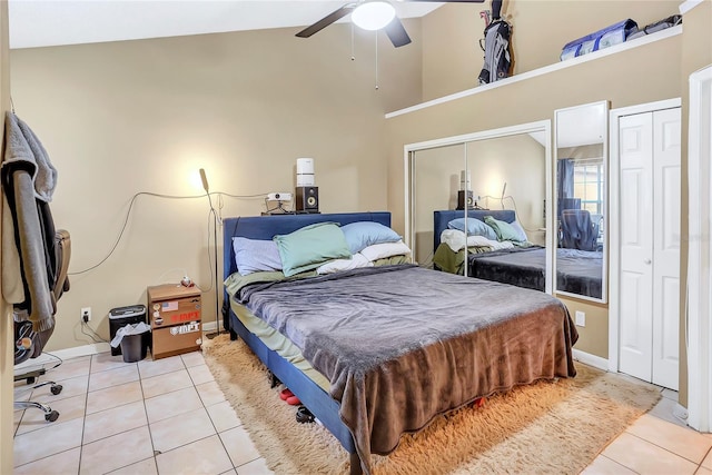 tiled bedroom featuring ceiling fan and high vaulted ceiling