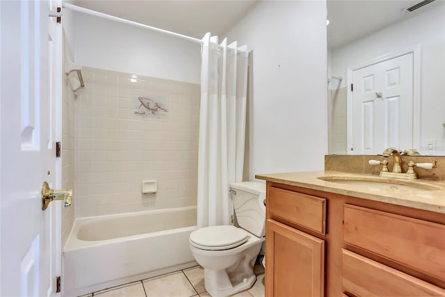 full bathroom featuring tile patterned flooring, vanity, toilet, and shower / bath combo with shower curtain