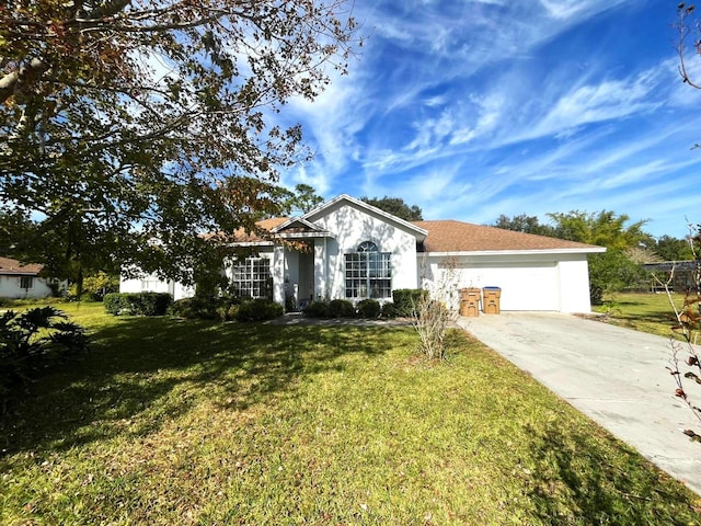 ranch-style home featuring a front yard and a garage