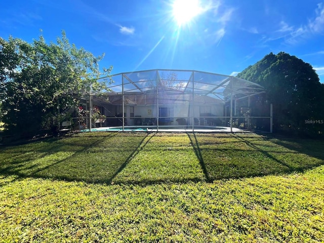 view of yard with a lanai