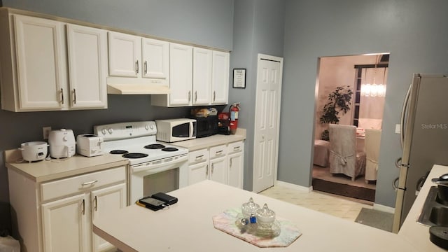 kitchen featuring white appliances and sink