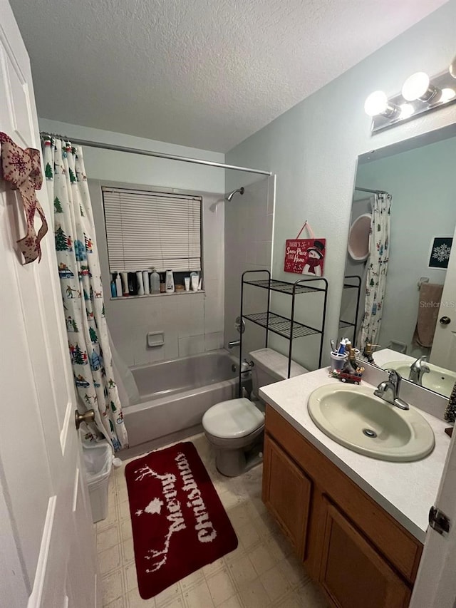 full bathroom with a textured ceiling, shower / tub combo, vanity, and toilet