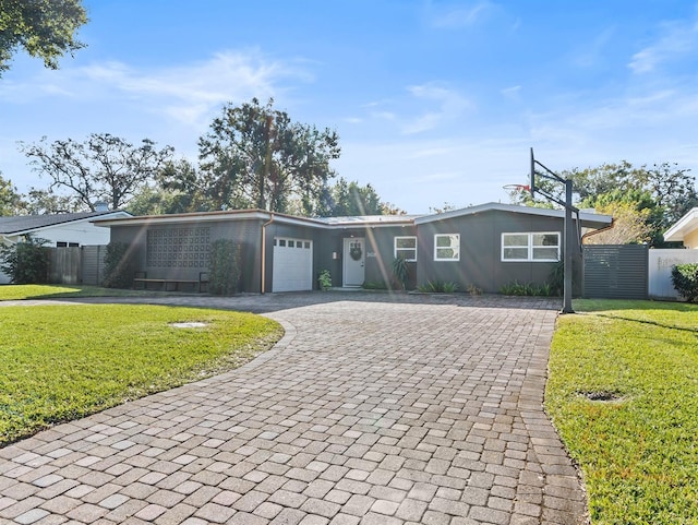 ranch-style house with a front yard and a garage