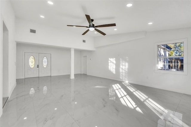 interior space featuring ceiling fan