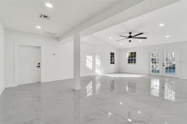 unfurnished room with lofted ceiling and french doors