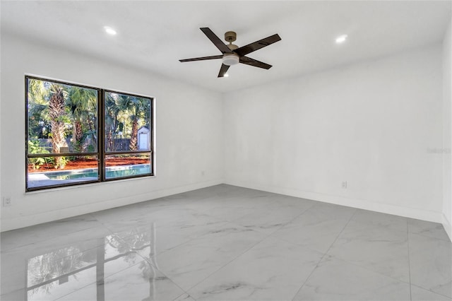 unfurnished room featuring ceiling fan and a healthy amount of sunlight