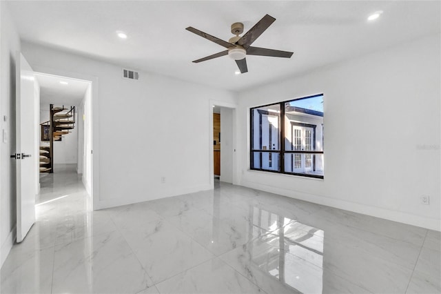 unfurnished room featuring ceiling fan