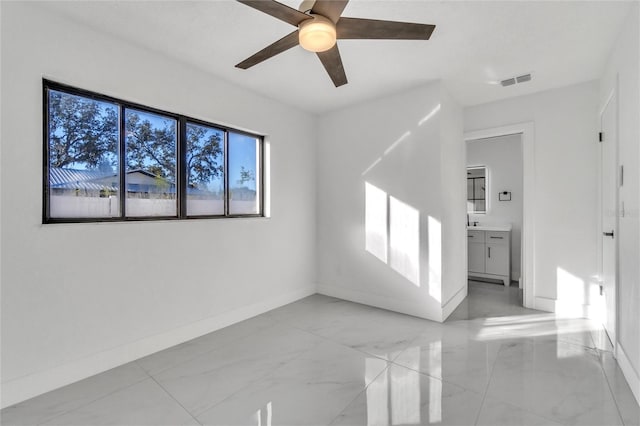 unfurnished room with ceiling fan