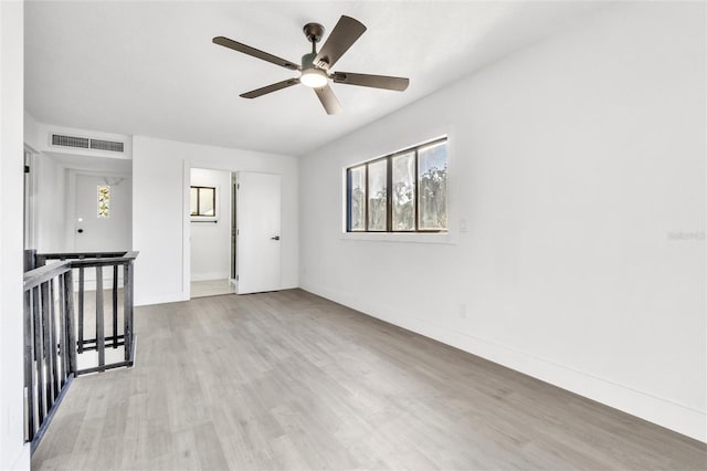 spare room with ceiling fan and light hardwood / wood-style floors