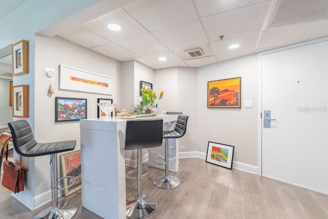 151 E Washington St Unit 201, Orlando, FL 32801 - bar area with recessed lighting, wood finished floors, and a drop ceiling