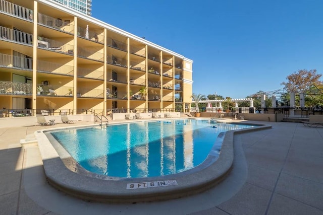 view of swimming pool with a patio