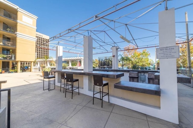 view of patio / terrace featuring an outdoor bar