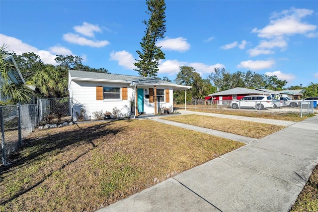 ranch-style house with a front lawn and a porch