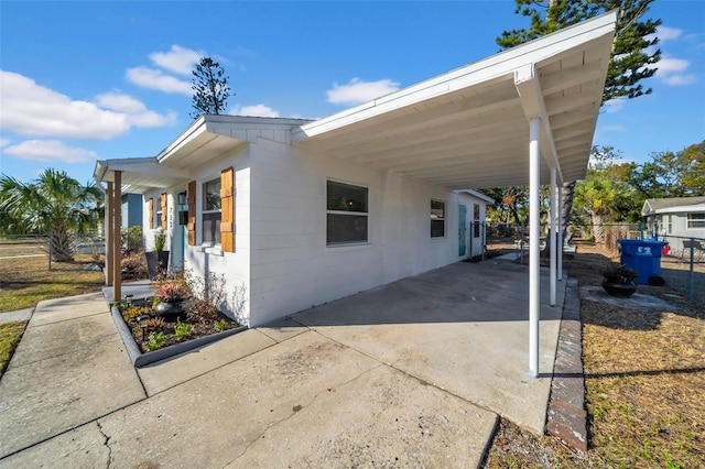 view of side of home featuring a carport