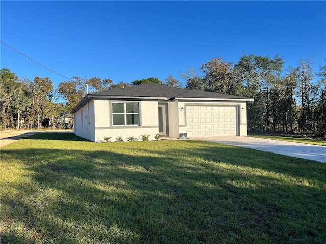 view of front of property featuring a garage and a front lawn