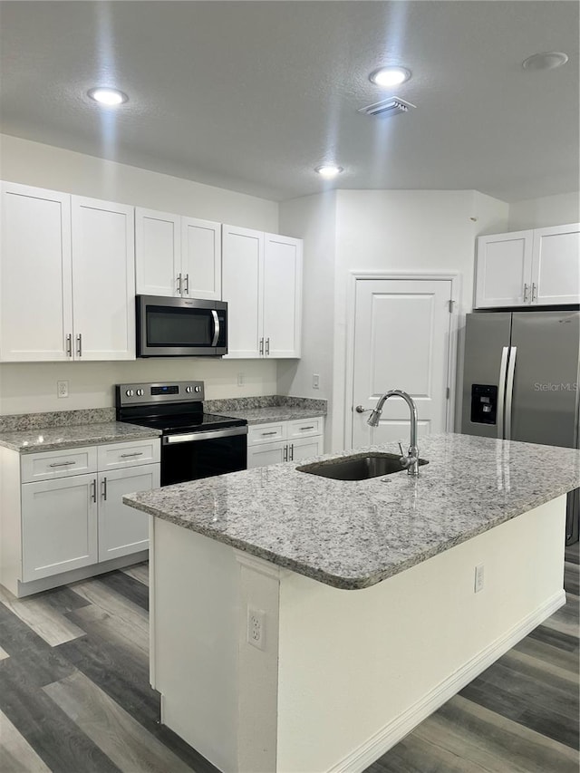 kitchen featuring white cabinetry, sink, and appliances with stainless steel finishes