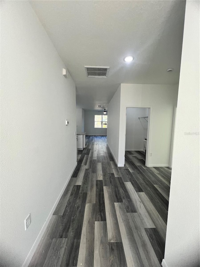 hallway featuring dark hardwood / wood-style floors