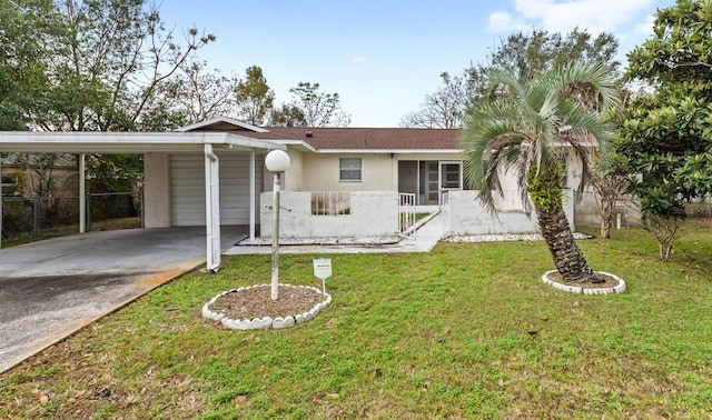 single story home with a front yard, a carport, and a sunroom