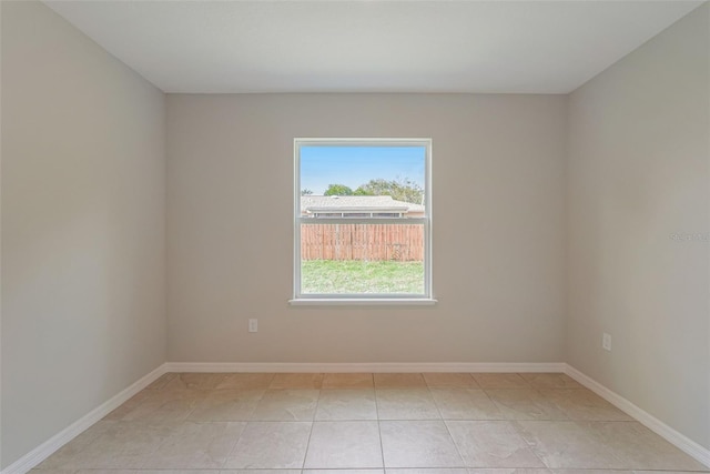 empty room with light tile patterned floors