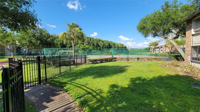 view of yard featuring tennis court