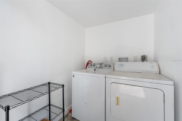 clothes washing area featuring washer and dryer