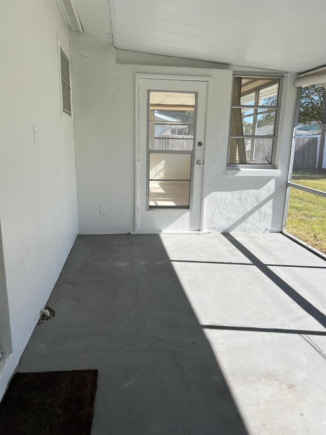 unfurnished sunroom featuring plenty of natural light