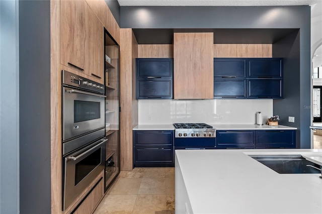 kitchen with light tile patterned floors and appliances with stainless steel finishes