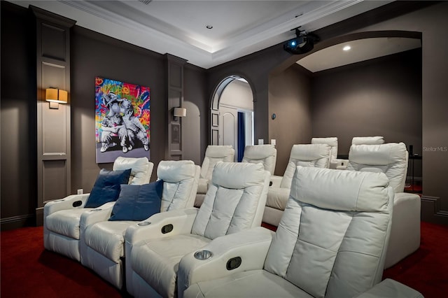 home theater featuring dark carpet and crown molding