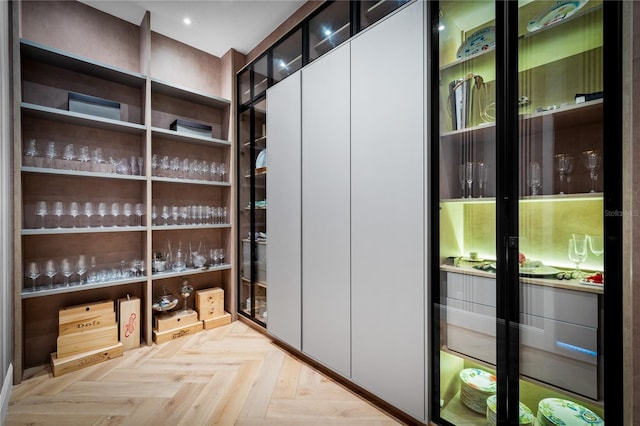 spacious closet with light parquet floors