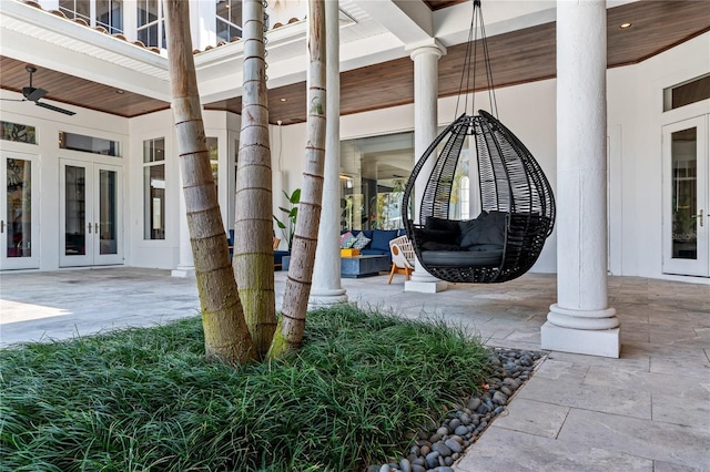 entrance to property featuring ceiling fan and french doors