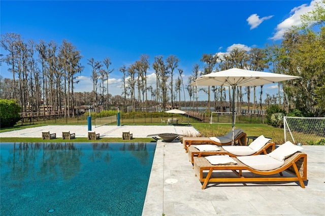 view of pool with a yard