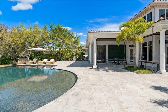 view of swimming pool featuring a patio area