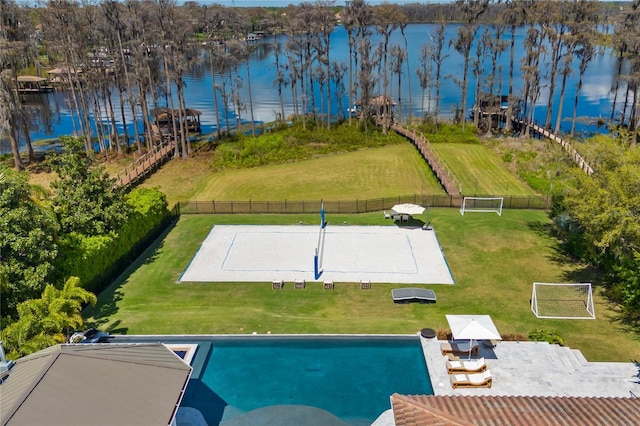 view of swimming pool featuring a water view