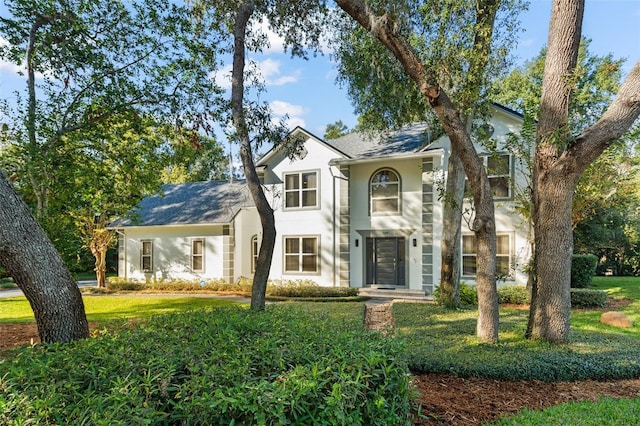 view of front of property with a front lawn