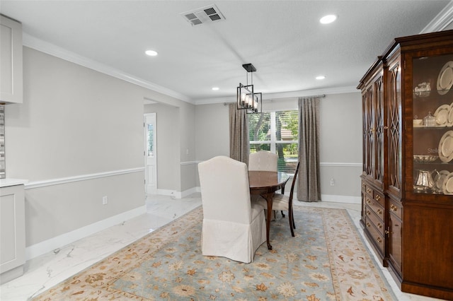 dining space with a chandelier and ornamental molding