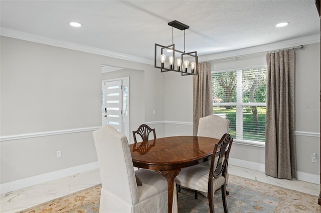 dining room featuring a chandelier, a healthy amount of sunlight, a textured ceiling, and ornamental molding