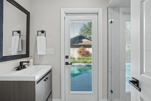 doorway to outside featuring a wealth of natural light and sink