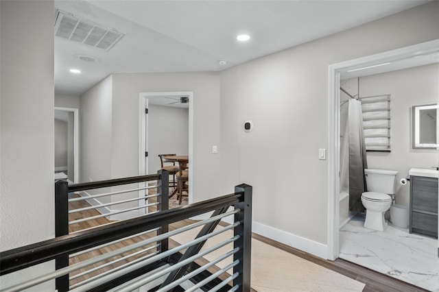 corridor featuring light hardwood / wood-style flooring