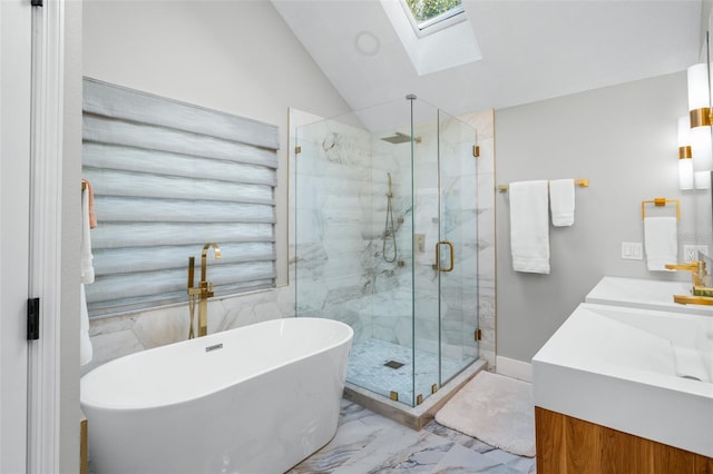 bathroom featuring vanity, separate shower and tub, and vaulted ceiling with skylight