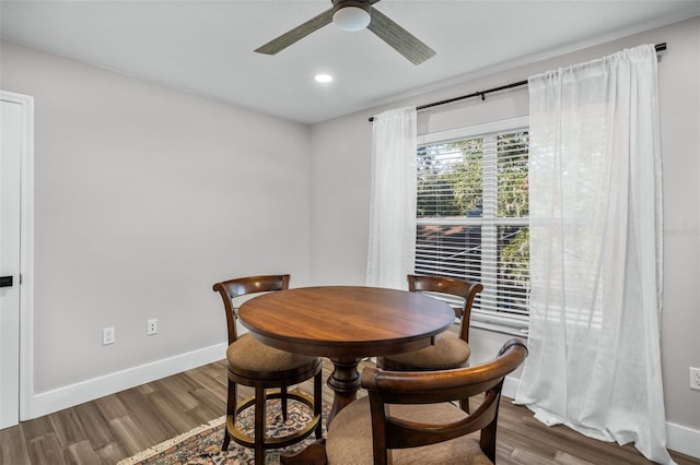 dining space featuring hardwood / wood-style floors and ceiling fan