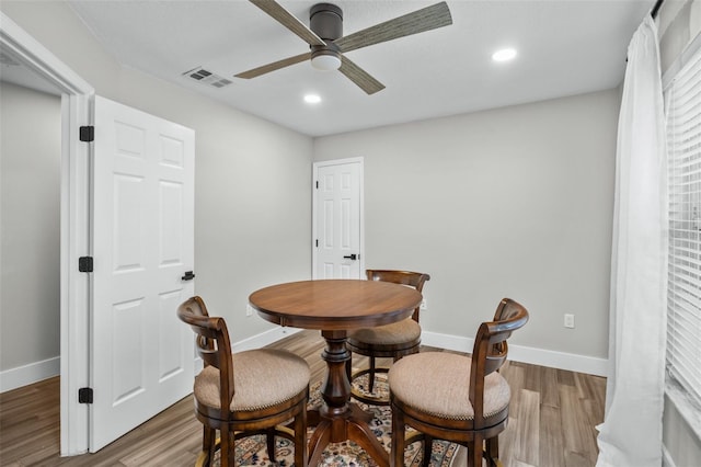 dining area featuring hardwood / wood-style floors and ceiling fan