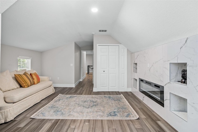 living room with lofted ceiling and wood-type flooring