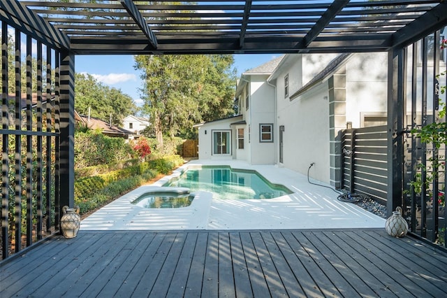 wooden deck featuring a pool with hot tub